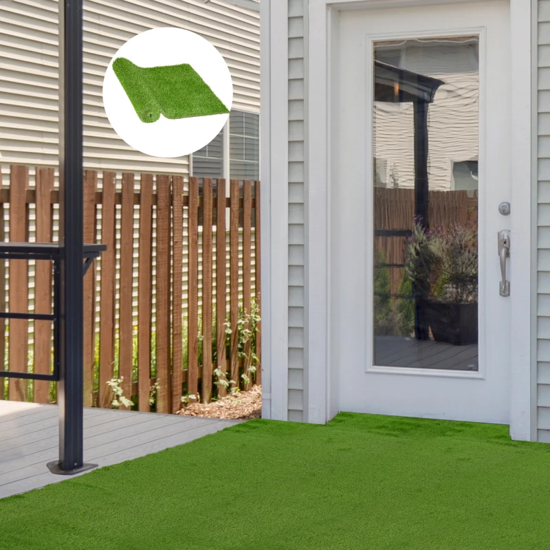 Fully installed artificial grass on patio with circular inset showing rolled synthetic turf sample.