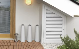 Installing interlocking deck tiles by clicking them into place on a flat surface