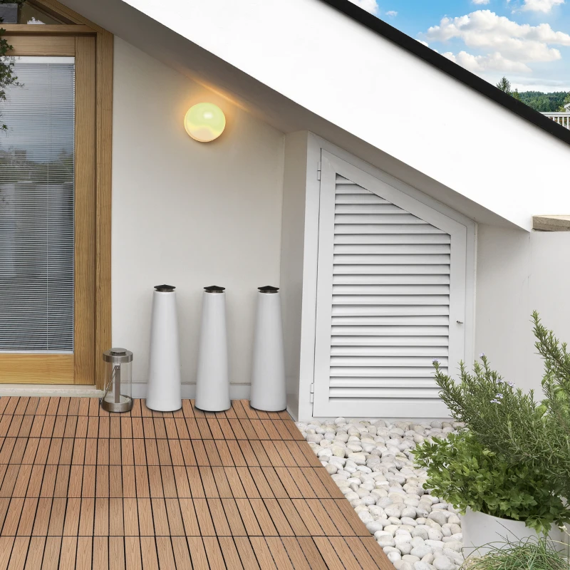 Installing interlocking deck tiles by clicking them into place on a flat surface.