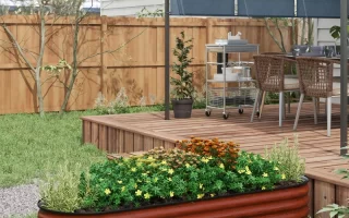A well-maintained raised garden bed with various plants growing.