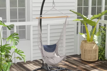 stylish hammock chair arranged in a bright, modern indoor setting.