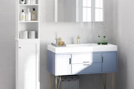 Modern bathroom with blue vanity, gold legs, mirrored cabinet, and tall white storage shelves.