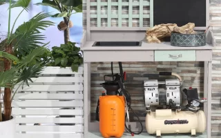 Outdoor potting station with potted plants, watering cans, and decorative gardening tools.