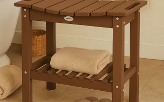 Teak shower bench with folded towels and slippers beside a bathtub in a tiled bathroom.