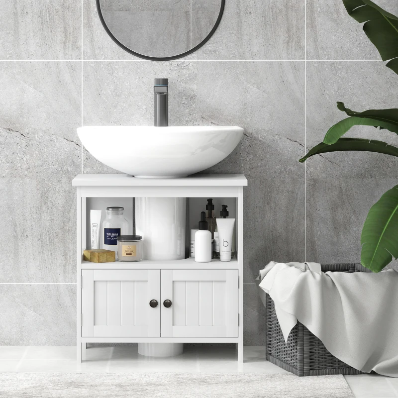 Sleek bathroom vanity with open shelving, minimal decor, and round mirror against tiled wall.