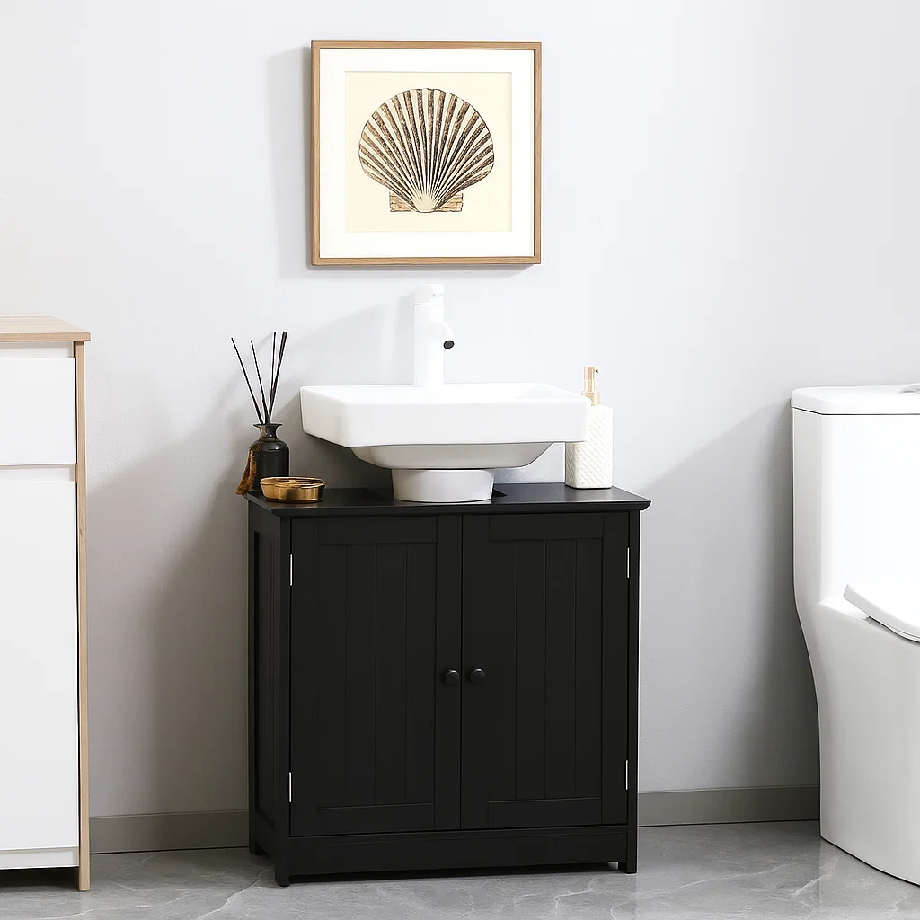 Black bathroom cabinet under a modern sink, styled with a shell print and simple accessories.
