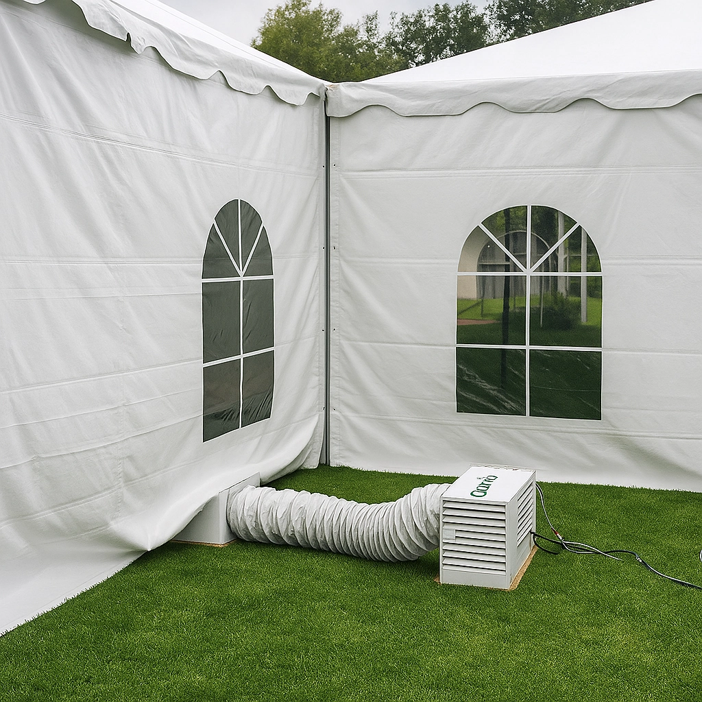 Portable electric heater connected to canopy tent for climate control at outdoor events.