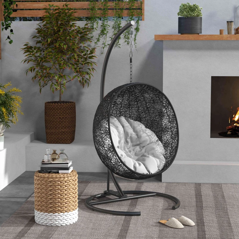 Compact hammock chair hanging in a small apartment corner, saving valuable floor space.