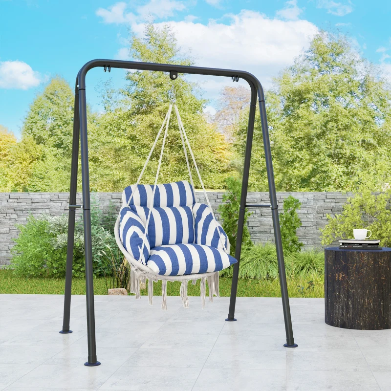 swing chair with tassels hanging on a porch with plants.