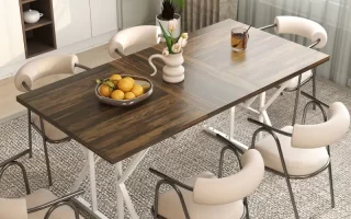 Cozy dining space featuring a wooden table with mixed chairs under pendant lights near windows