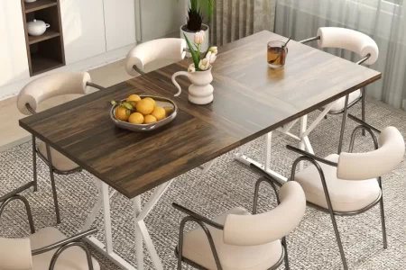 Cozy dining space featuring a wooden table with mixed chairs under pendant lights near windows