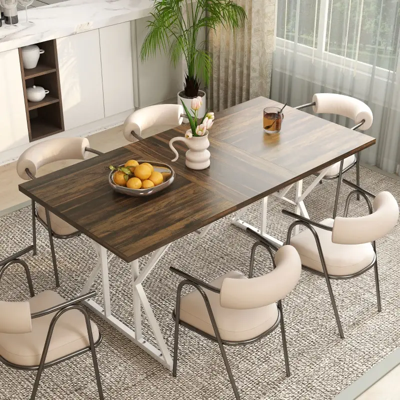 Cozy dining space featuring a wooden table with mixed chairs under pendant lights near windows