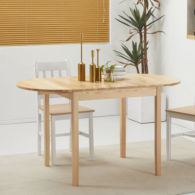 Minimalist wooden dining table with chairs and golden decor in a clean, well-lit dining room.