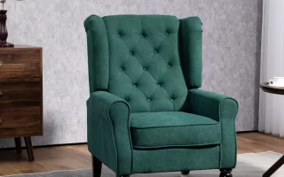 Green upholstered accent chair with button tufting in a modern living room