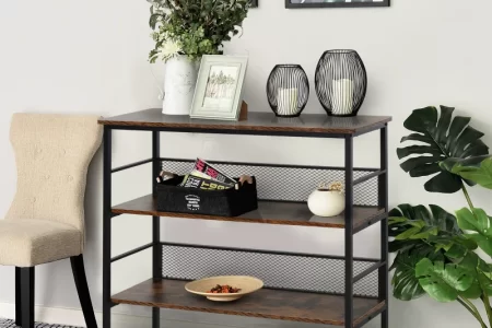 Console table with earthy textures, sculptural decor, and framed minimal line art in warm tones.