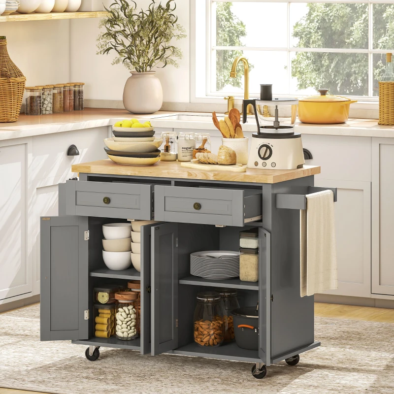 Grey kitchen island with open storage filled with plates, bowls, and glass jars.