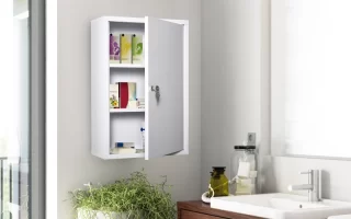 White wall cabinet installed above sink in a modern bathroom with indoor plants nearby.