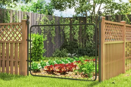 Installed garden gate with metal frame and wire mesh beside wooden lattice fencing.