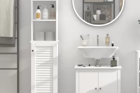 Modern bathroom with white cabinet, open shelving, round mirror, and organized toiletries.