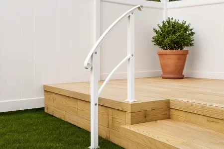 Painted white outdoor stair railing in sunlight.