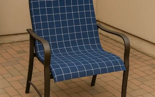Reupholstered patio chair with new blue checkered fabric in an outdoor setting