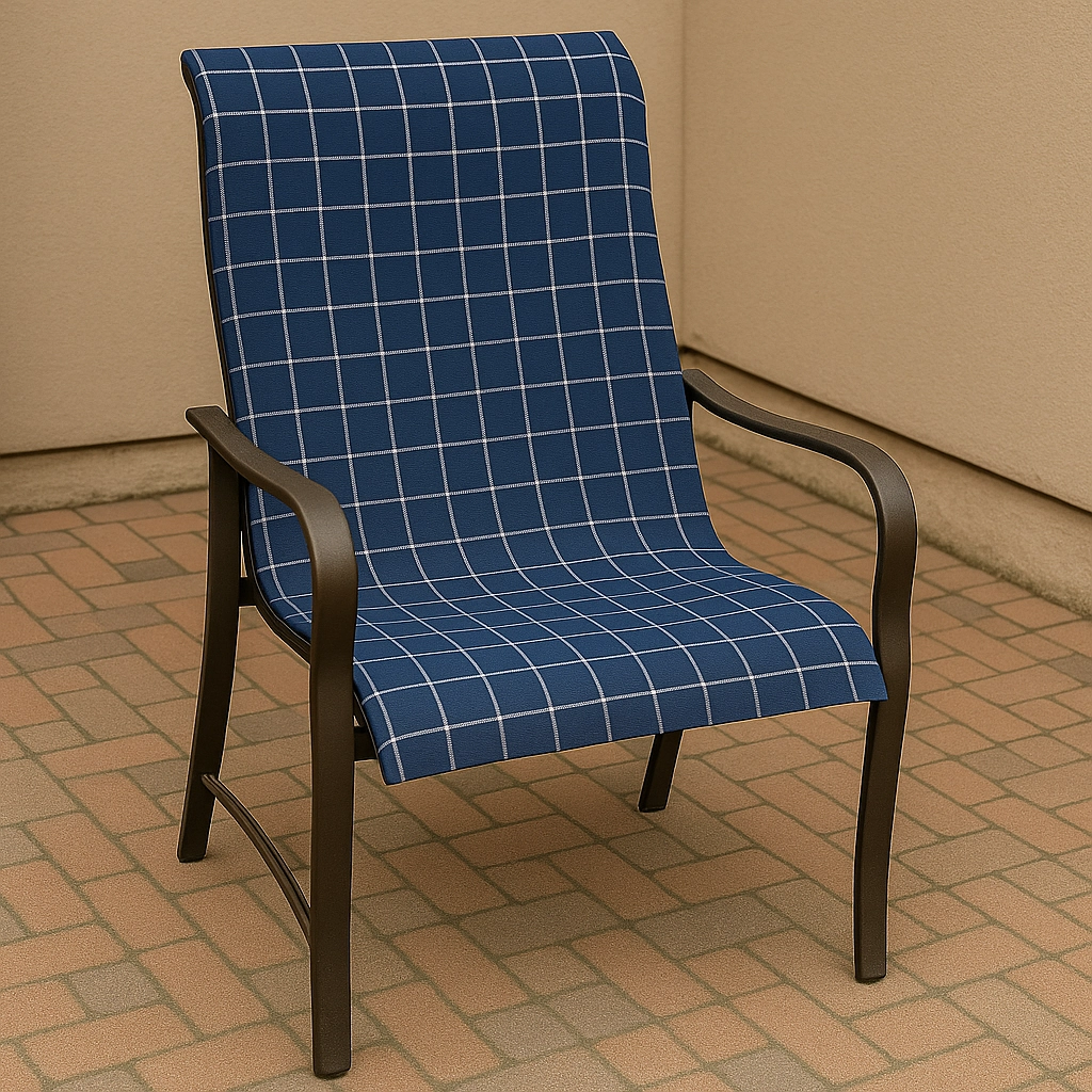 Reupholstered patio chair with new blue checkered fabric in an outdoor setting.