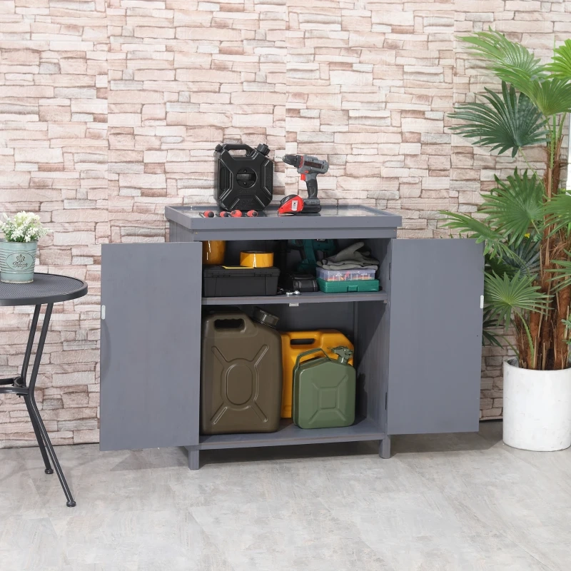 Open cabinet with tools and cans showing how to organize and weatherproof outdoor storage