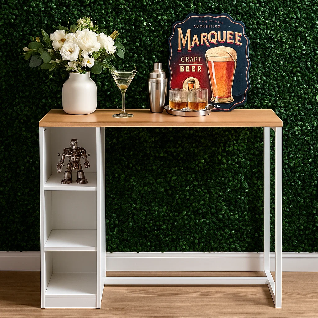 Home bar table styled with a bouquet, martini glass, and retro beer sign against green wall.
