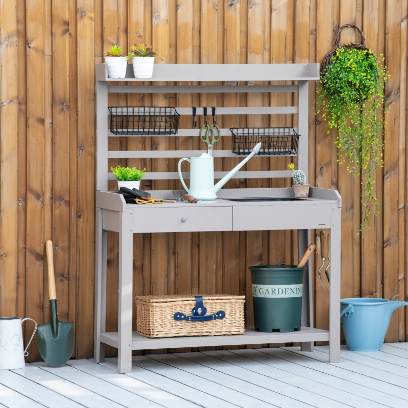 Neutral-toned wooden bench with vertical slatted back, baskets, hooks, and wire storage containers.