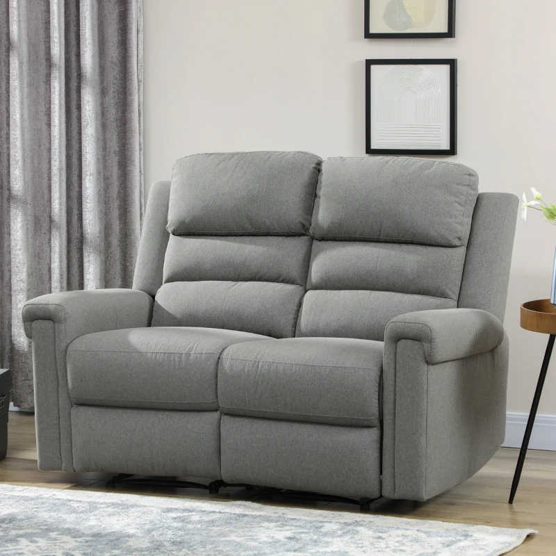 Large reclining sectional sofa with cup holders and storage console in spacious living room.