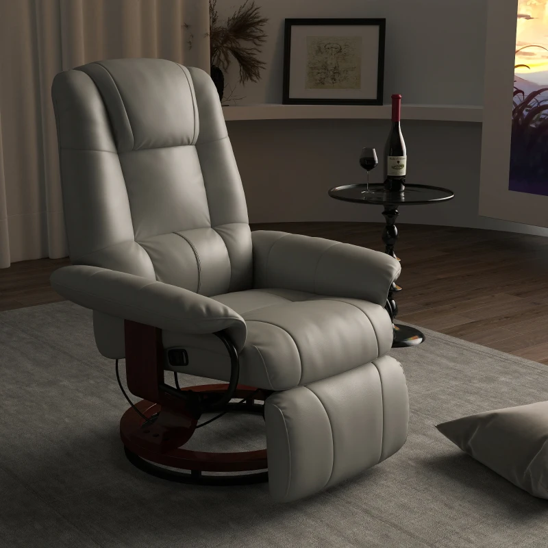 Swivel base recliner in tan leather, positioned next to round side table and floor lamp.