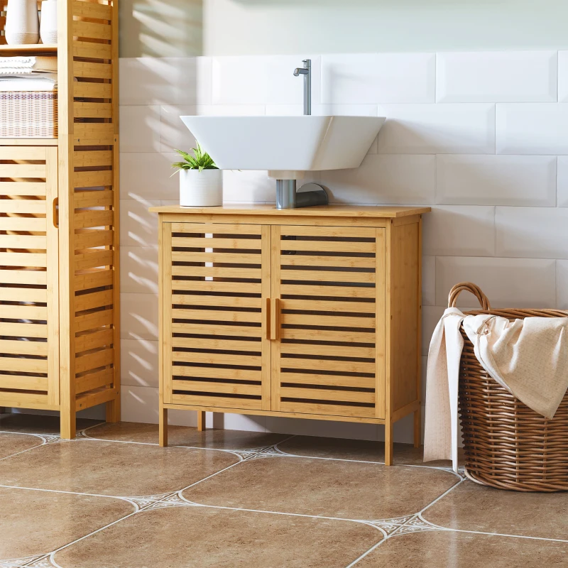 Bathroom with bamboo vanity and open storage, styled with a potted plant for fresh, natural decor.