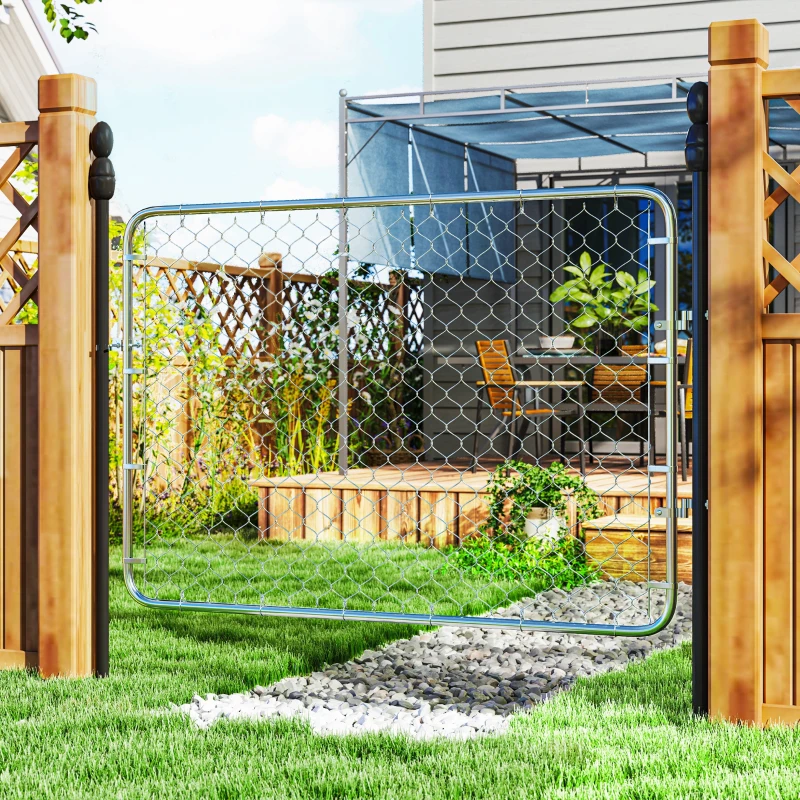 Installed garden gate on lawn pathway leading to patio area with outdoor seating.