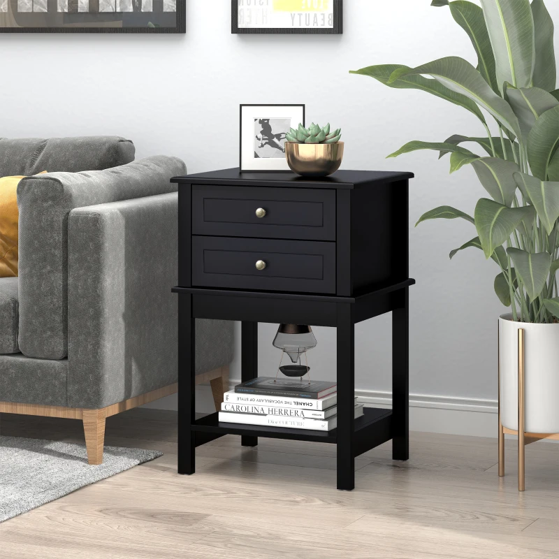 Classic black end table with drawers, books, a framed photo, and a small potted plant for decor

