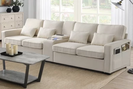 Neutral-toned sectional sofa with side pocket armrests in cozy setting.