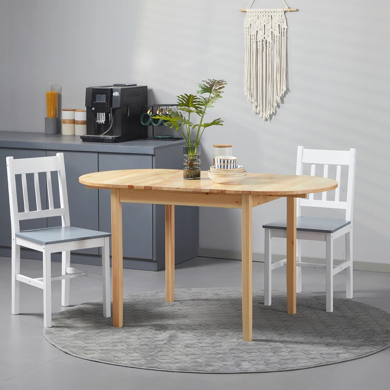 Rustic wooden dining table with bench seating and greenery centerpiece in farmhouse-style dining room