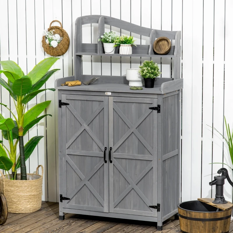 Rustic wooden outdoor cabinet with plants, styled for winter use and seasonal decor