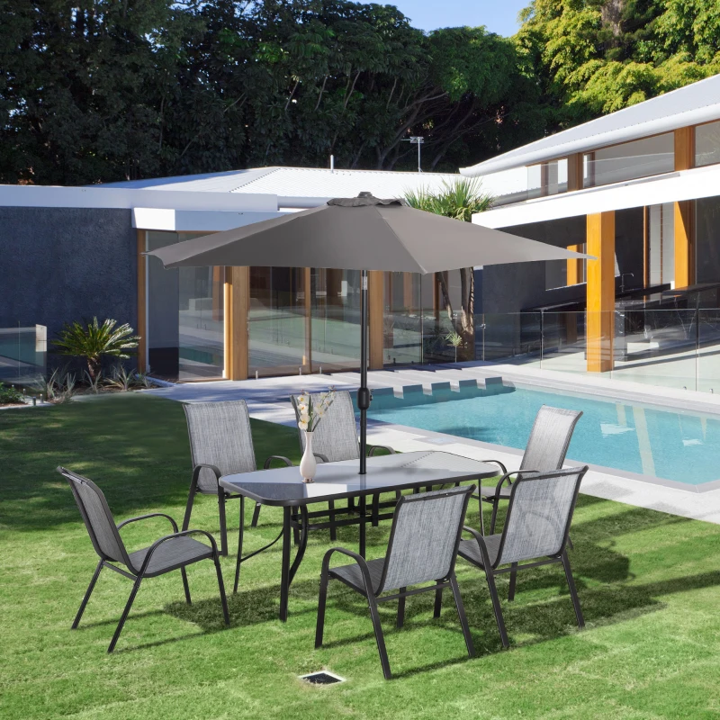 Outdoor dining set with umbrella and six chairs.