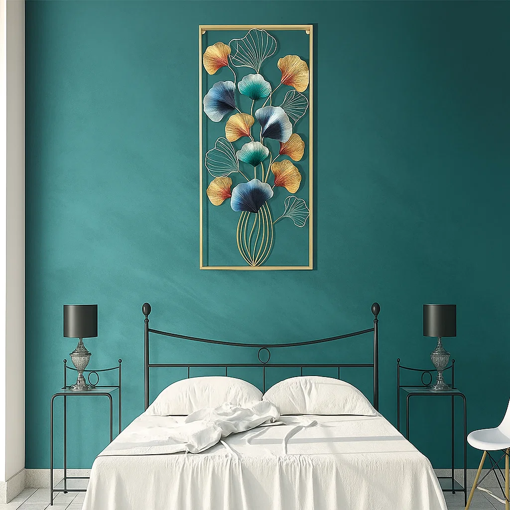 Large artwork above the bed creating a focal point, complementing the room’s color scheme.
