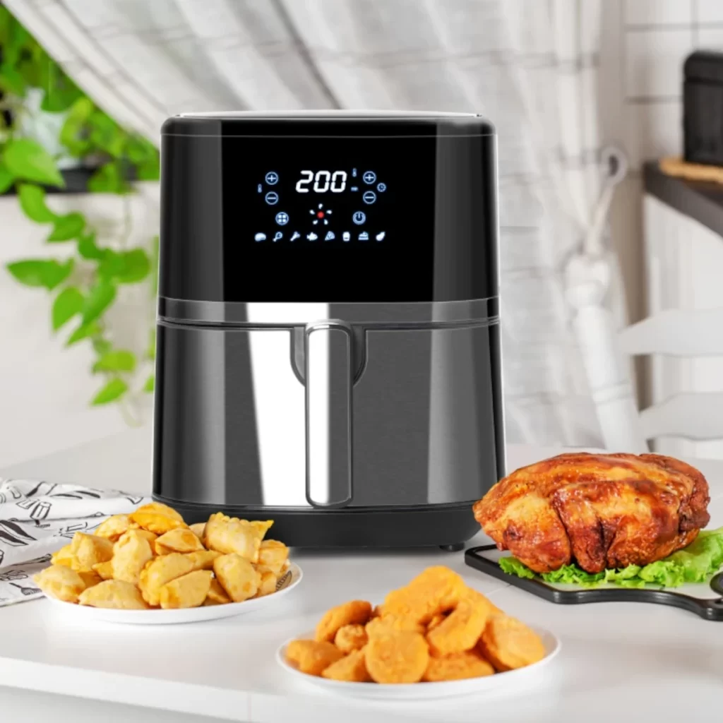 Digital basket air fryer with roasted chicken and fries.