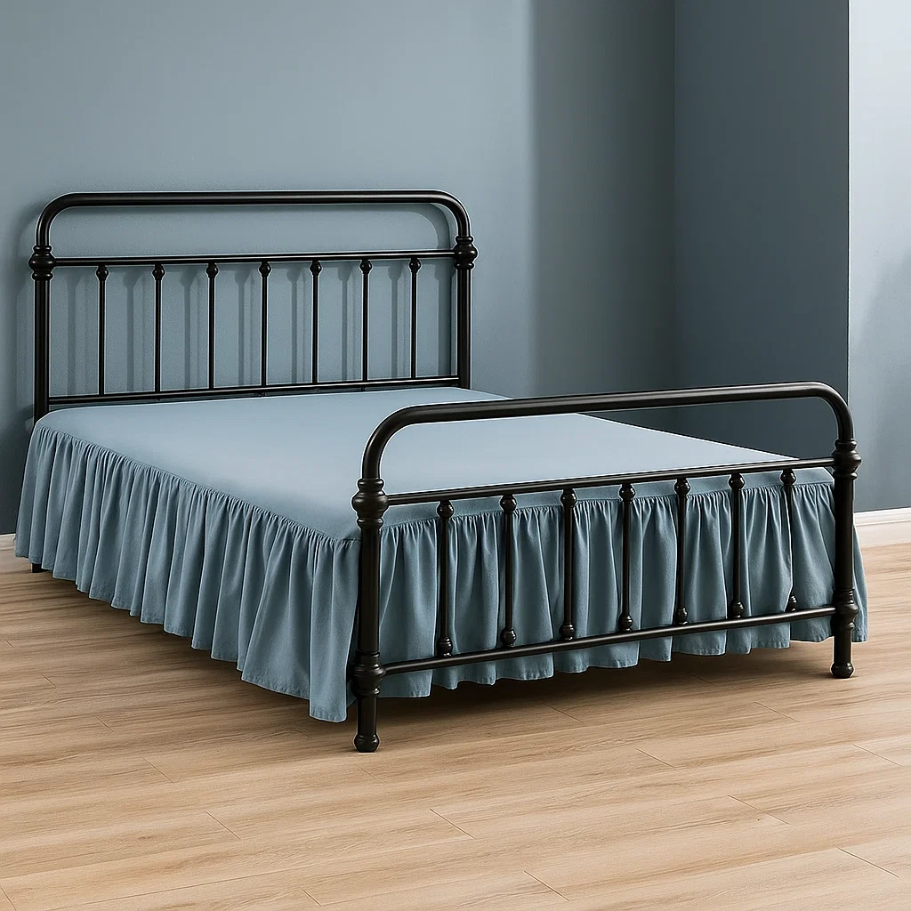 Blue ruffled skirt beneath black metal bed frame