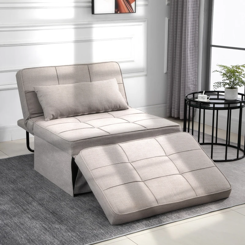 Light grey convertible futon chair extended into a lounger with side table and curtain in bright room.
