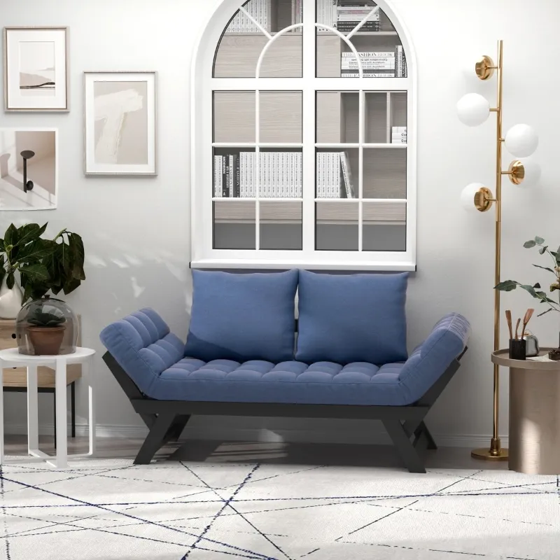 Blue cushion futon with black angled frame styled in a white room with window and modern decor.
