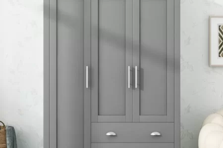 Grey wardrobe with drawers styled with home decor accents.