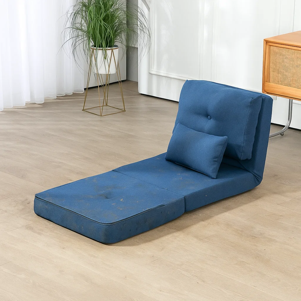 Dirty blue futon mattress placed on wooden floor

