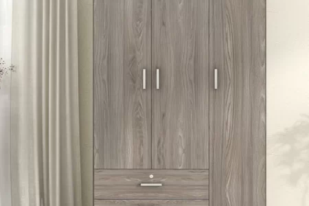 Large wooden wardrobe with three doors and bottom drawers