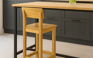 Finished natural wood bar stool beside a kitchen island.