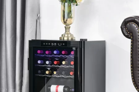 Black compact wine cooler with mixed wine bottles inside