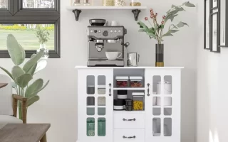 Buffet cabinet under art prints, styled with greenery, books, candle, and soft-toned personalized decor.