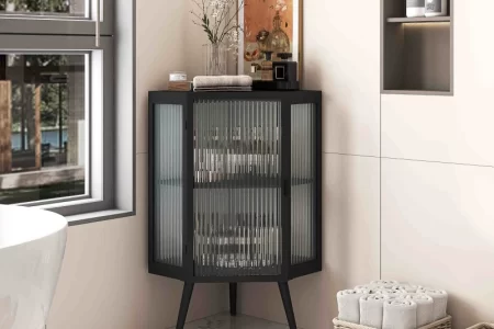 Black corner cabinet styled in a modern bathroom setting.